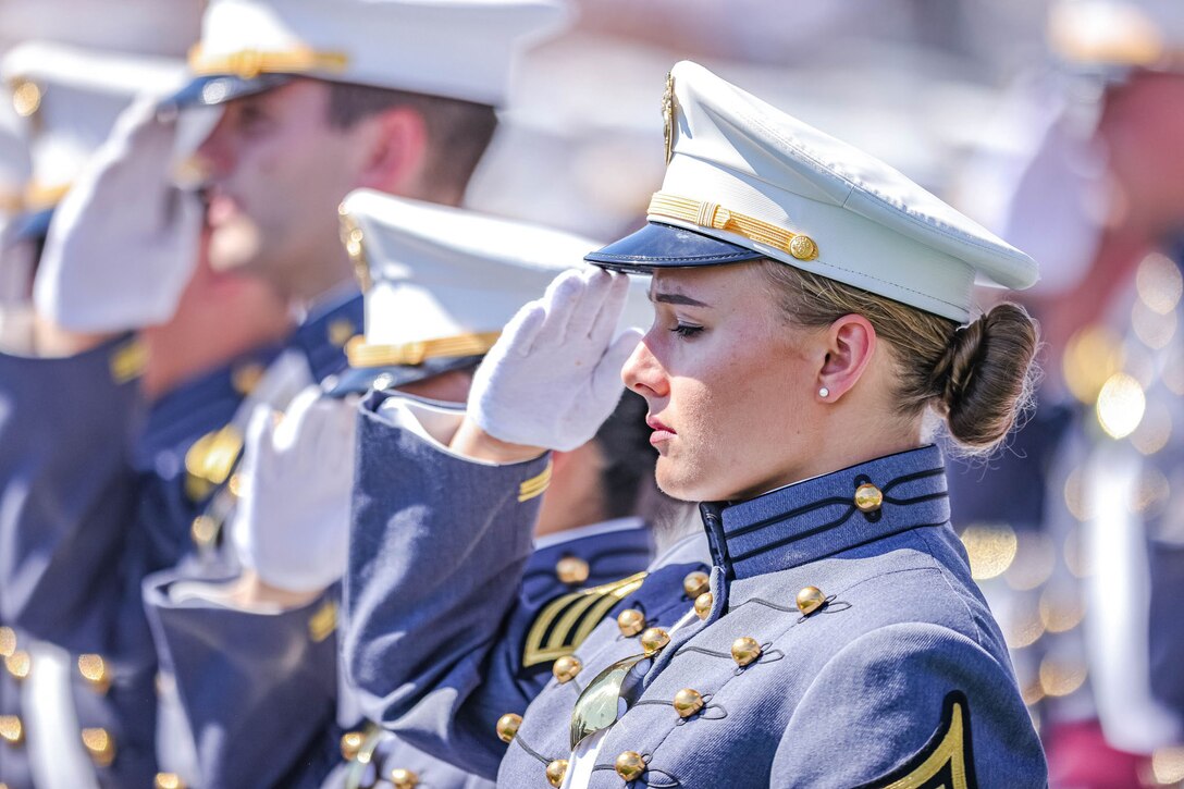 A cadet salutes.