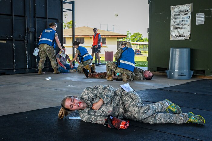 A patient simulates a missing hand during a roleplay medical exercise.