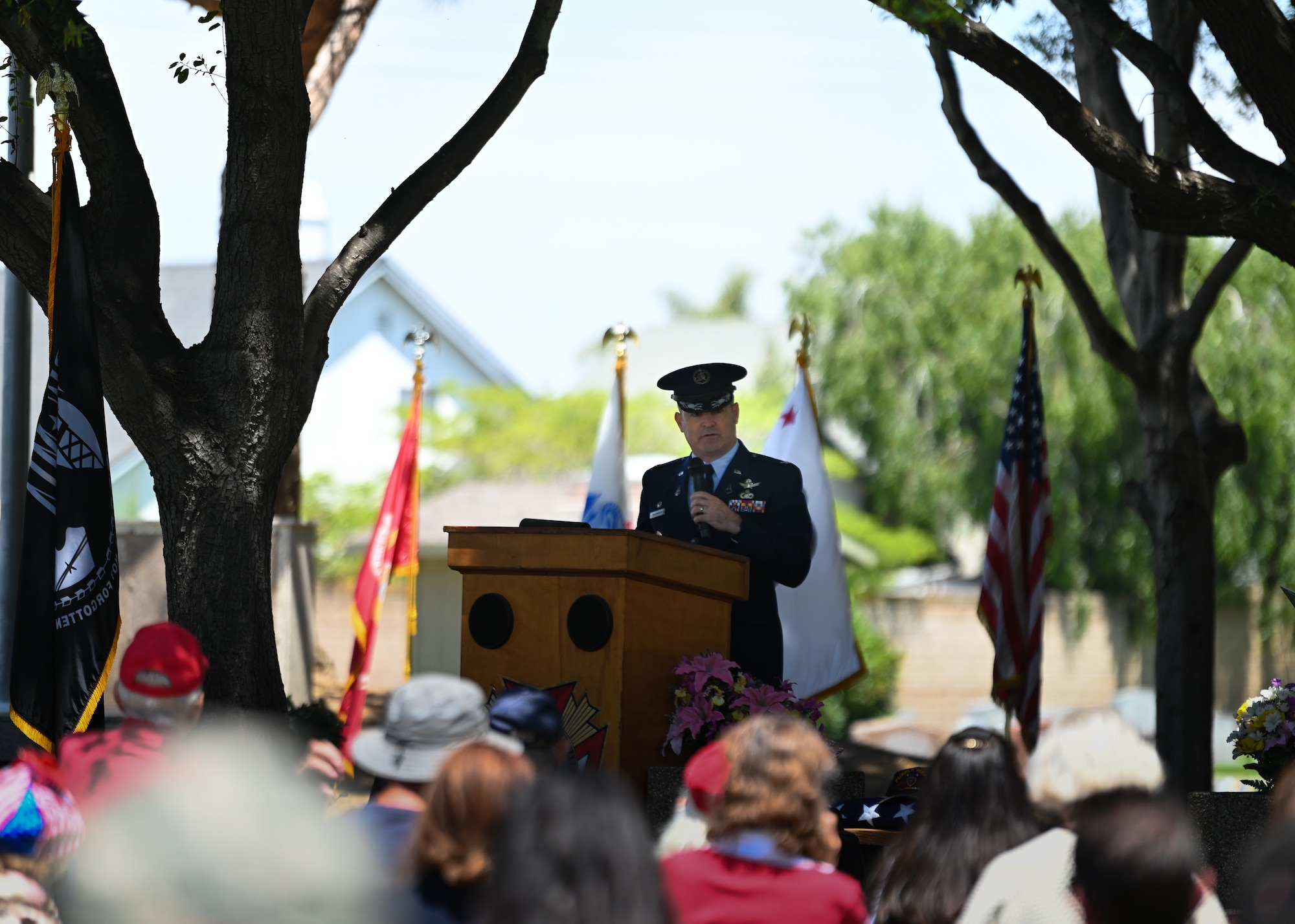 A man in uniform speaks during a ceremony.