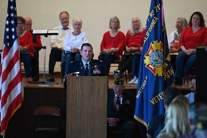 Col. Titus speaks in front of a crowd.