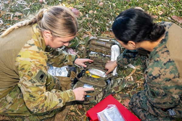 Australian Army PTE. Melissa Murray, left, a medical technician with 1st Health Battalion, 2nd Health Brigade, and U.S. Navy Petty Officer 3rd Class Ariana Buckley, a hospital corpsman with Combat Logistics Battalion 5 (Reinforced), Marine Rotational Force – Darwin 24.3, organize medical equipment during Valkyrie emergency fresh whole blood transfusion training at Robertson Barracks, Darwin, NT, Australia, May 16, 2024. The Valkyrie program enables military units to self-supply blood through emergency donor panels by adequate training, rehearsal, and preparation, gaining the skills and knowledge to efficiently collect whole blood, and conduct blood transfusions in the event of a casualty. Buckley is a native of New York. (U.S. Marine Corps photo by Cpl. Juan Torres)