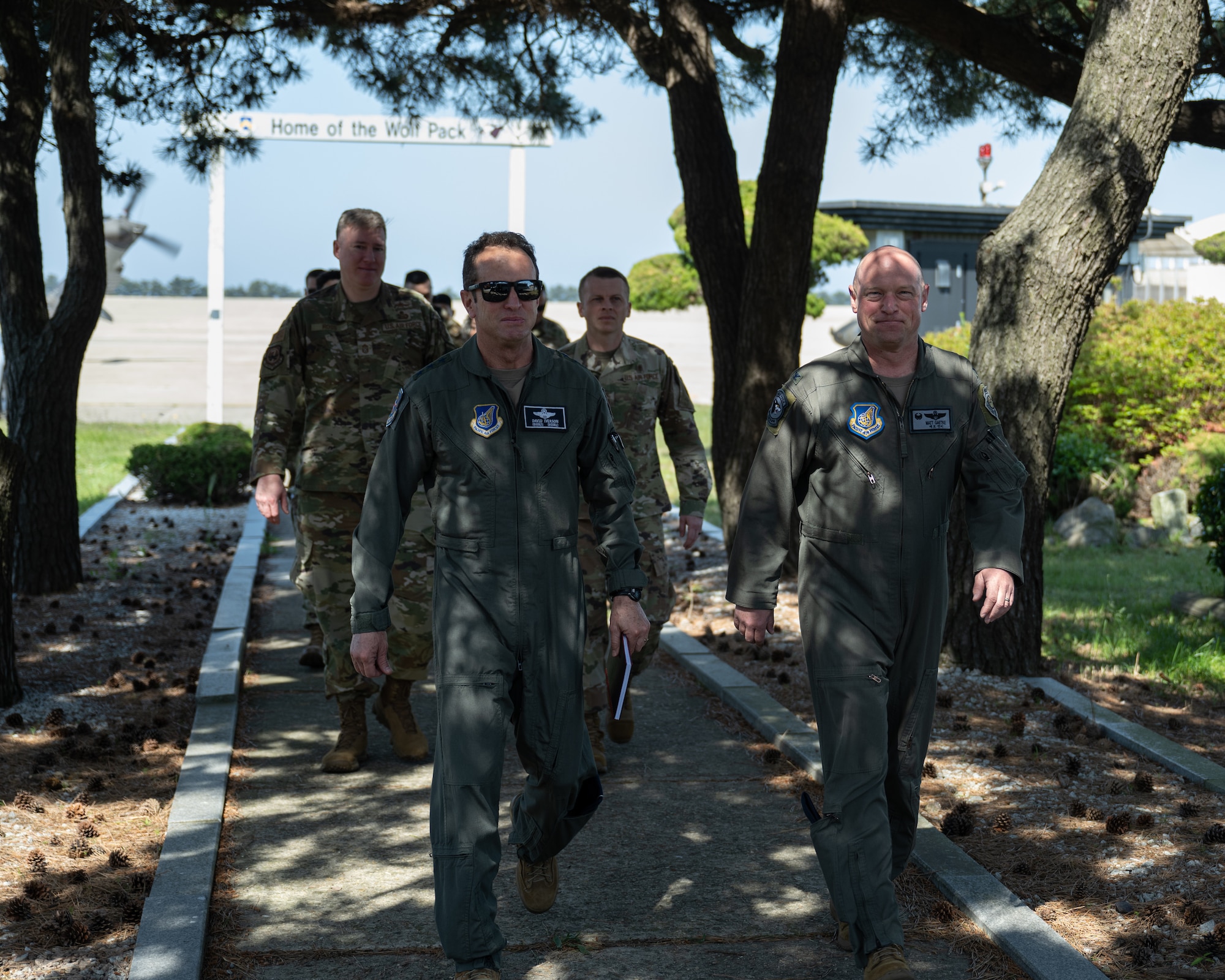 Lt. Gen. David Iverson, 7th Air Force commander, and Chief Master Sgt. Jeremiah Ross, 7th AF command chief, walk with 8th Fighter Wing leadership after arriving at Kunsan Air Base, Republic of Korea