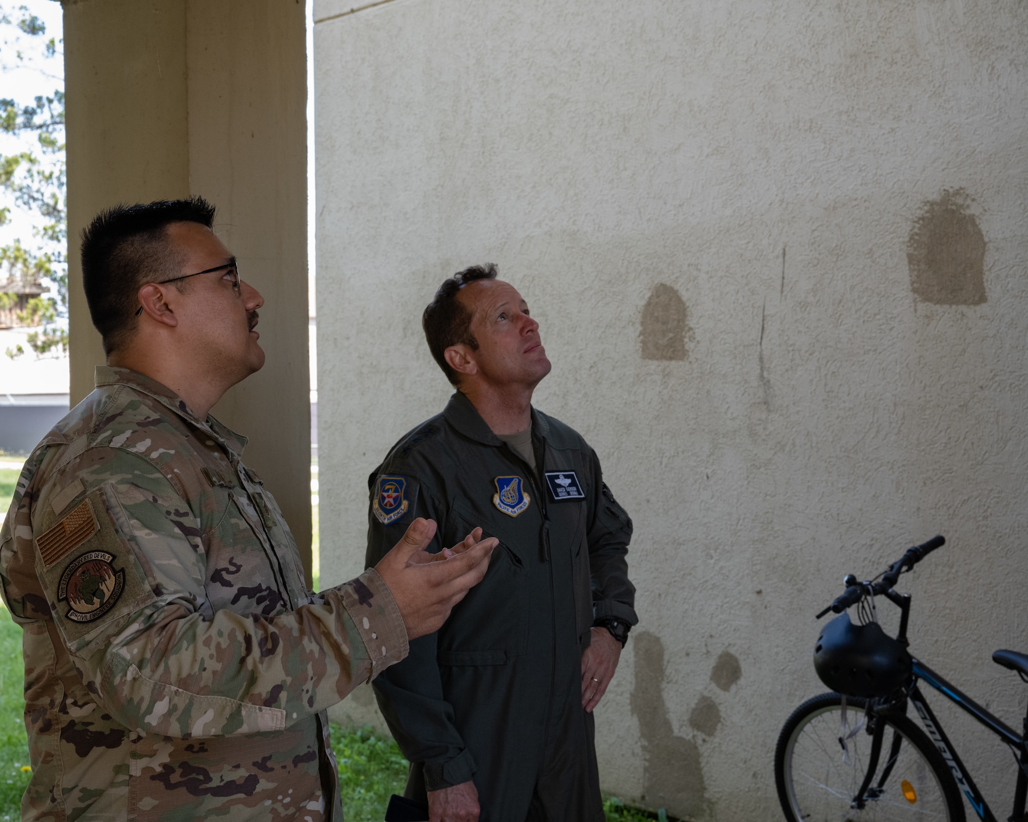 Staff Sgt. Cesar Alvarez, left, 8th Civil Engineer Squadron airman dorm leader, takes Lt. Gen. David Iverson, 7th Air Force commander, on a tour of a dorm building at Kunsan Air Base.