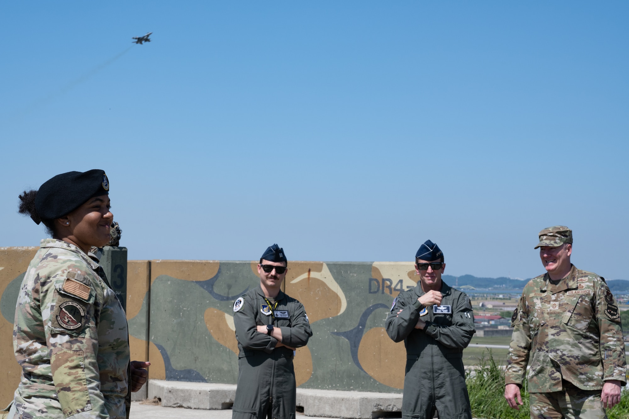 From the left, Staff Sgt. Aubrey Mathis, 8th Security Forces Squadron operations, briefs the 8th SFS mission to Capt. Adam Cincione, 8th Fighter Wing plans and program director, Lt. Gen. David Iverson, 7th Air Force commander, and Chief Master Sgt. Jeremiah Ross, 7th AF command chief, during their visit at Kunsan Air Base, Republic of Korea.