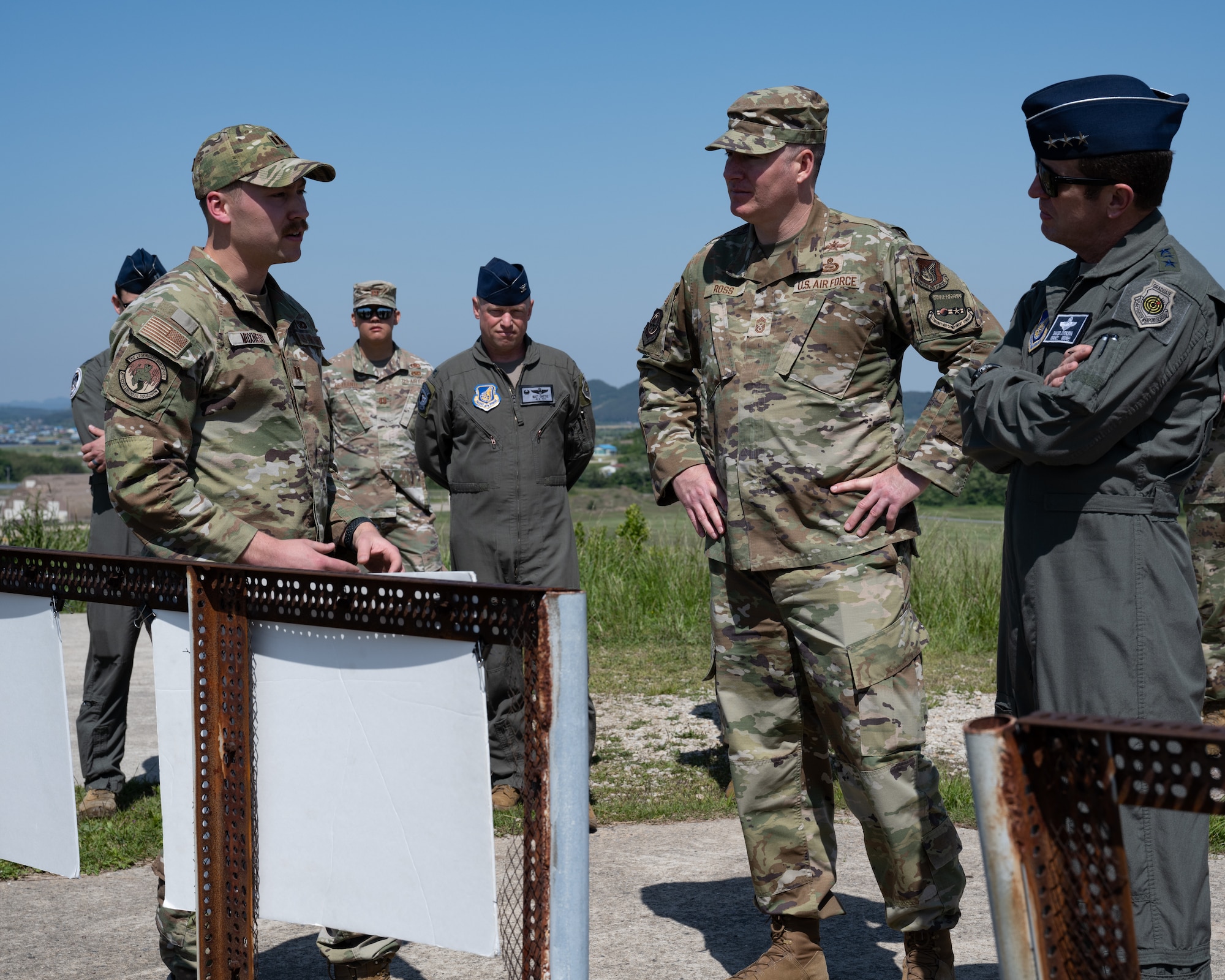 From the left, Capt. Michael Moxness, 8th Civil Engineer Squadron plans and programs office portfolio optimization chief, showcases future development plans to Lt. Gen. David Iverson, 7th Air Force commander, and Chief Master Sgt. Jeremiah Ross, 7th AF command chief, at Kunsan Air Base, Republic of Korea.