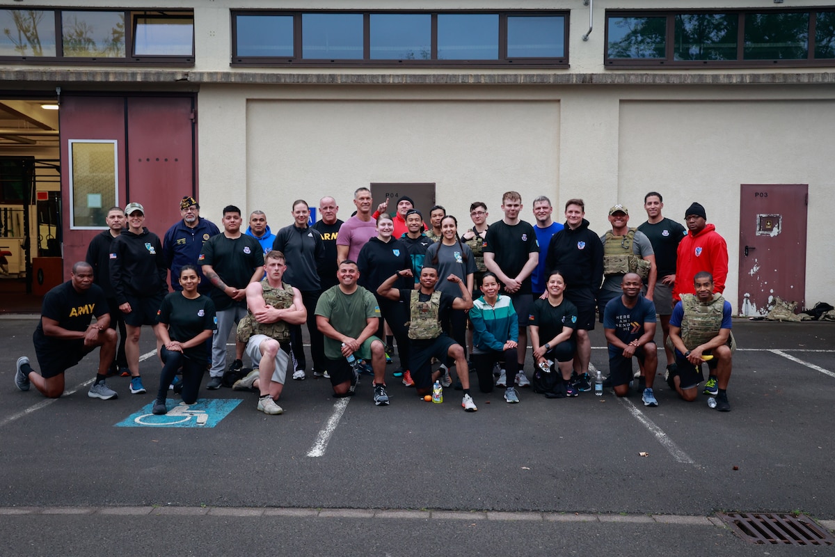 Soldiers belonging to the 21st Theater Sustainment Command pose for a group photo after participating in the Murph Challenge