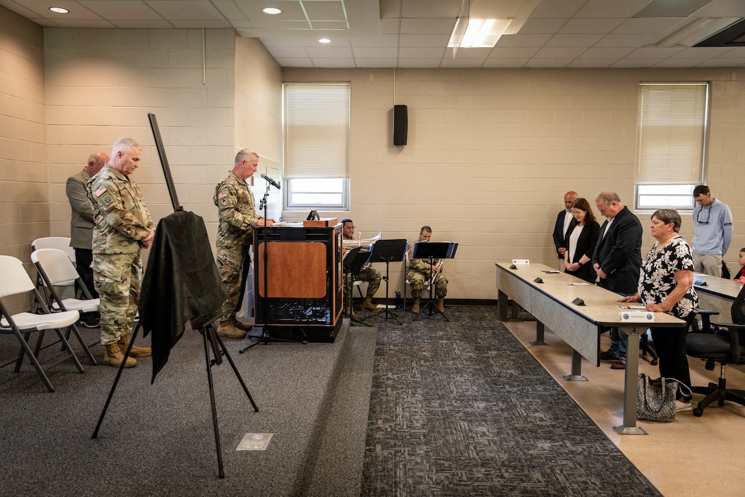 U.S. Army Chaplain (Col.) Bill Draper gives the invocation for the building renaming ceremony in remembrance of Chief Warrant Officer 5 Joe Wilkins at Wendell H. Ford Regional Training Center (WHFRTC) in Greenville, Kentucky on May 24, 2024. Wilkins was one of three full-time employees at WHFRTC during the formation of the state training site. (U.S. Army National Guard photo by Andy Dickson)
