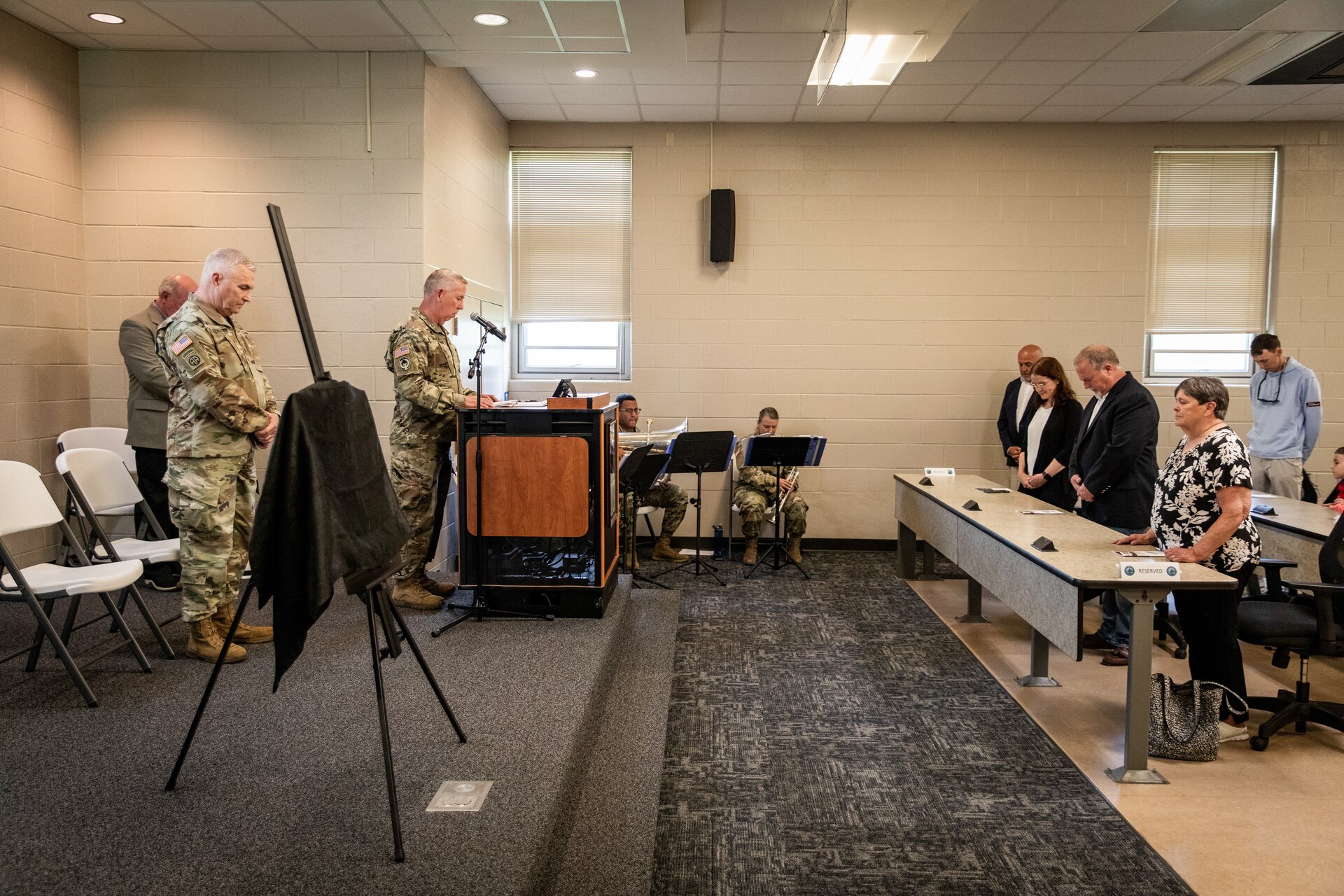 U.S. Army Chaplain (Col.) Bill Draper gives the invocation for the building renaming ceremony in remembrance of Chief Warrant Officer 5 Joe Wilkins at Wendell H. Ford Regional Training Center (WHFRTC) in Greenville, Kentucky on May 24, 2024. Wilkins was one of three full-time employees at WHFRTC during the formation of the state training site. (U.S. Army National Guard photo by Andy Dickson)