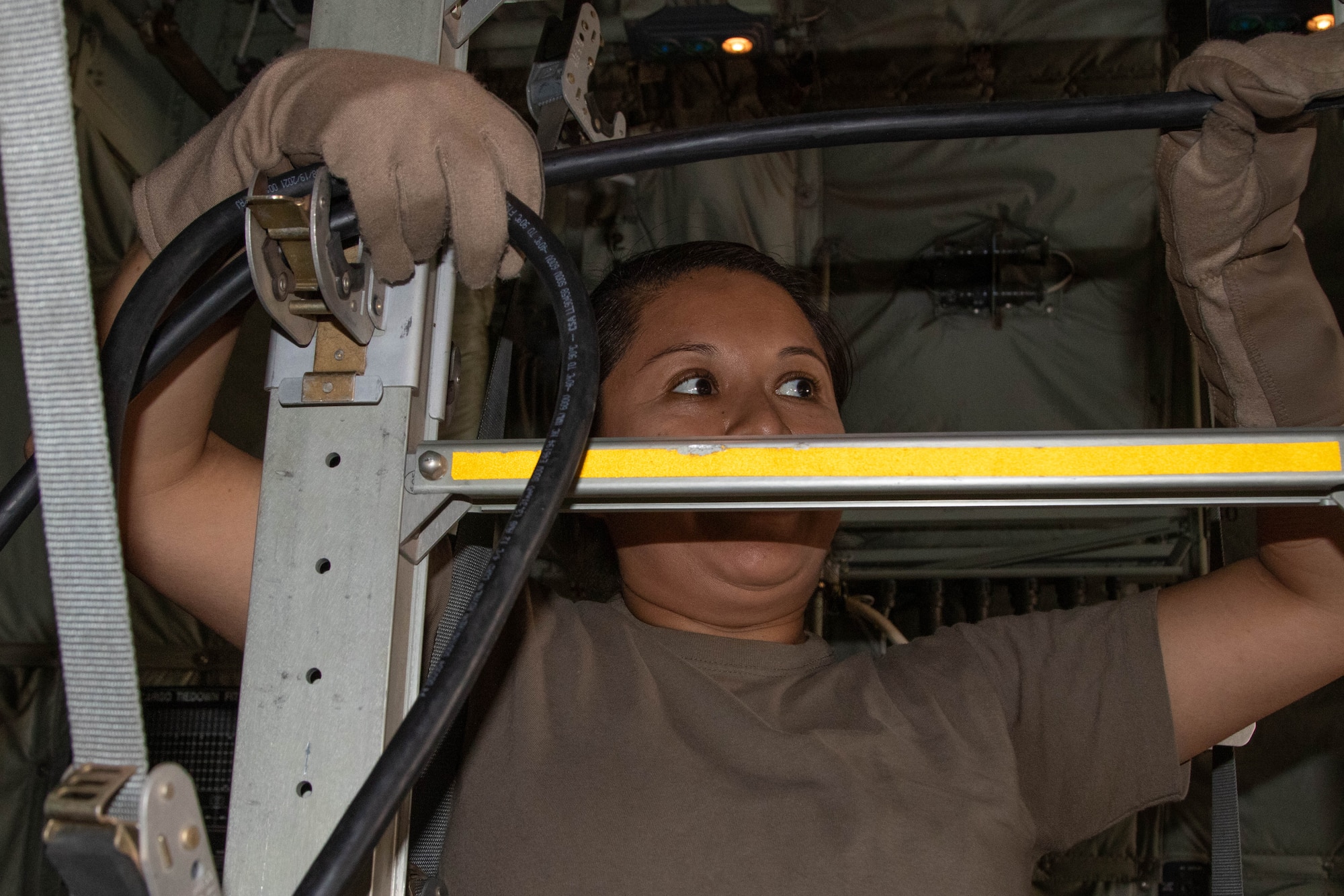 U.S. Air Force Capt. Maria Oliver, a nurse with the 86th Aeromedical Evacuation Squadron based in Ramstein, Germany, works inside a Tunisian C-130 aircraft during aeromedical evacuation training at exercise African Lion 2024 (AL24) in Tunis, Tunisia, May 2, 2024. AL24 marks the 20th anniversary of U.S. Africa Command’s premier joint exercise led by U.S. Army Southern European Task Force, Africa (SETAF-AF), running from April 19 to May 31 across Ghana, Morocco, Senegal and Tunisia, with over 8,100 participants from 27 nations and NATO contingents. (U.S. Army photo by Maj. Joe Legros)