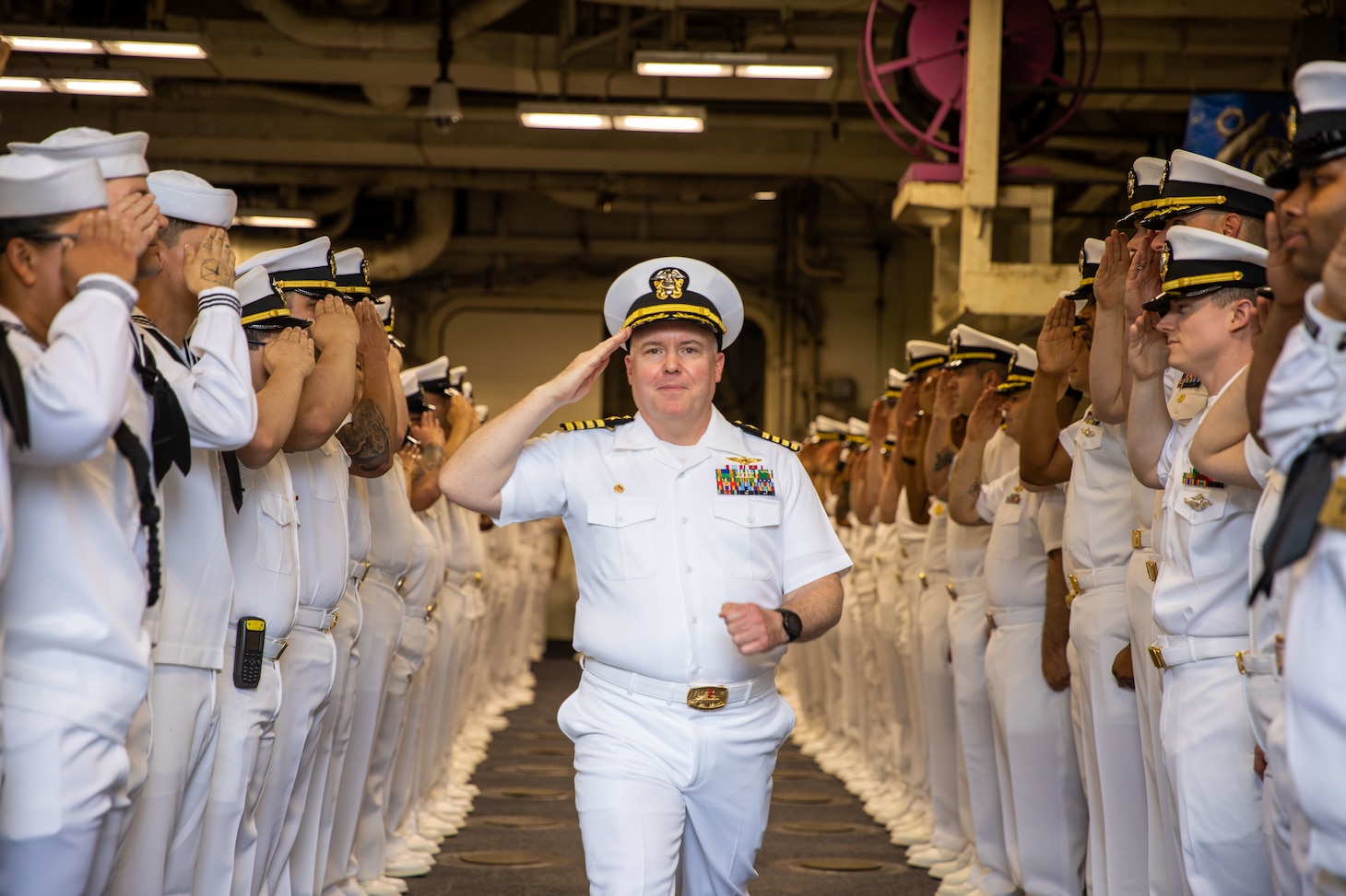 Iwo Jima is moored at Naval Station Norfolk in Norfolk, Virginia, at the end of her scheduled maintenance period. The change of command ceremony is a traditional Navy ceremony where the ship's crew witness the transfer of power from the commanding officer to the prospective commanding officer.