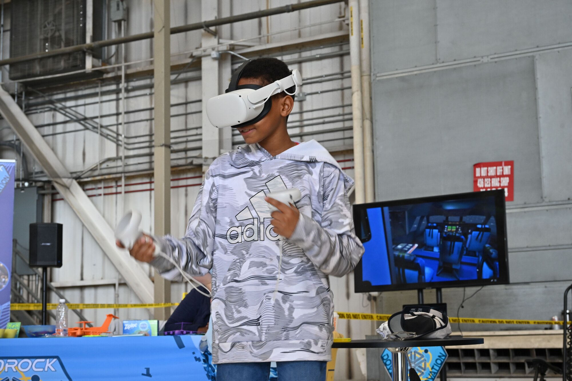 A member of Team Dover utilizes a virtual reality rig during the First State Airshow at Dover Air Force Base, Delaware, May 17, 2024. The First State Airshow hosted thousands of visitors, including more than 2,300 students and teachers from local school districts, during the free two-day event. (U.S. Air Force photo by Senior Airman Dieondiere Jefferies)