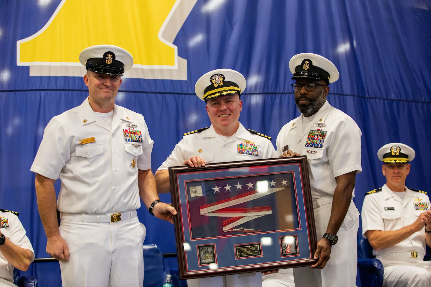 Iwo Jima is moored at Naval Station Norfolk in Norfolk, Virginia, at the end of her scheduled maintenance period. The change of command ceremony is a traditional Navy ceremony where the ship's crew witness the transfer of power from the commanding officer to the prospective commanding officer.