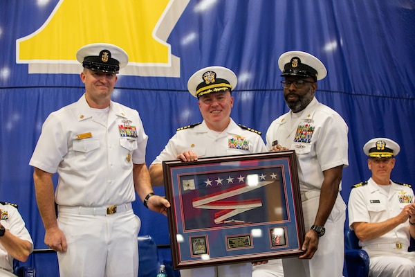 Iwo Jima is moored at Naval Station Norfolk in Norfolk, Virginia, at the end of her scheduled maintenance period. The change of command ceremony is a traditional Navy ceremony where the ship's crew witness the transfer of power from the commanding officer to the prospective commanding officer.