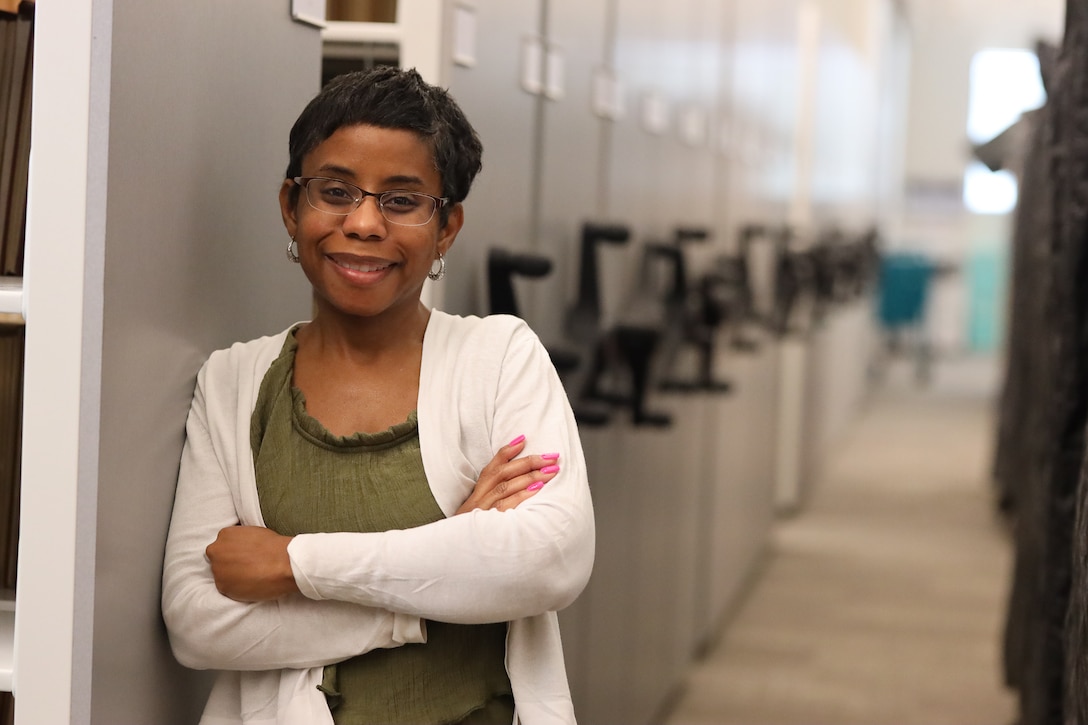 Joycelynn Brooks stands in the ERDC library in Vicksburg, MS.