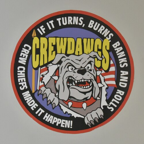 A logo with a bulldog is on a wall