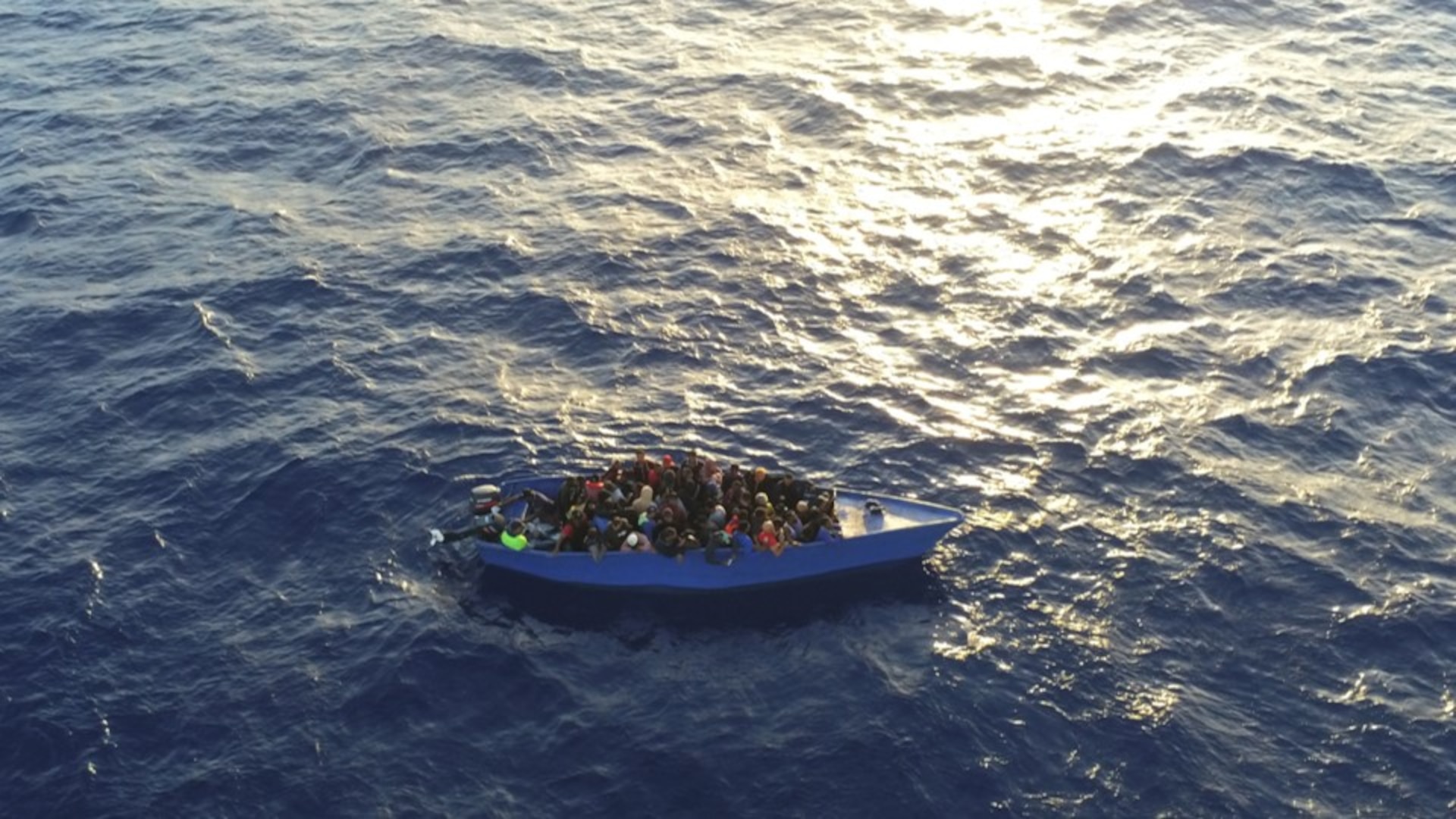 Photo of a grossly overloaded makeshift vessel shortly before being interdicted by the Coast Guard Cutter Richard Dixon May 21, 2024, approximately 63 nautical miles north of Punta Cana, Dominican Republic.  The interdicted migrants were returned to the Dominican Republic. (U.S. Coast Guard photo).