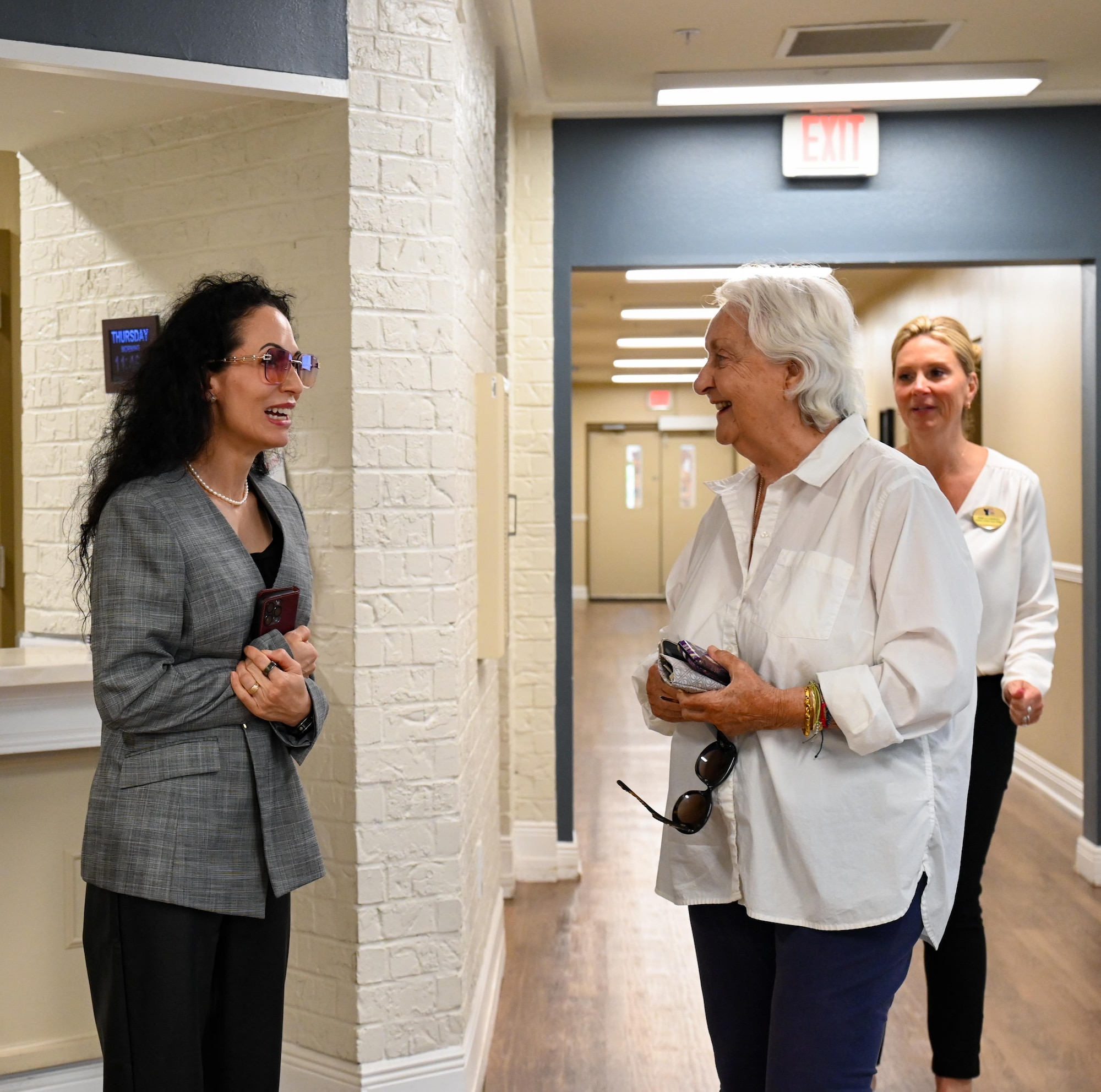 Dr. Doniel Wolfe, wife of U.S. Air Force CMSgt Wolfe, command Chief of Air Combat Command, talk with a resident of the Air Force Enlisted Village during their tour at Eglin Air Force Base, Florida, April 10, 2024. The Air Force Enlisted Village is a 55+ retirement community for retired enlisted military members and their surviving spouses and a 501(c)(3) not-for-profit community, that focuses on providing a rich, rewarding and active retirement lifestyle for their residents. (U.S. Air Force photo by Capt. Benjamin Aronson)