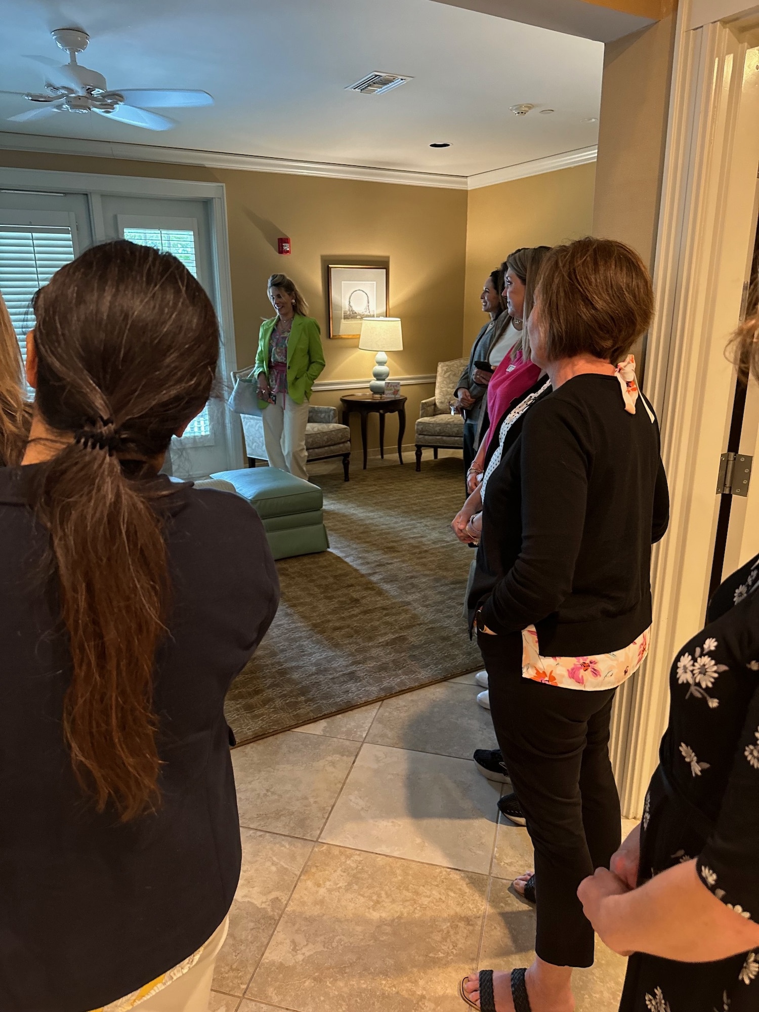 Cindy Wilsbach, wife  of U.S. Air Force Gen. Ken Wilsbach, commander of Air Combat Command, talks to a group of workers at the Fisher House of the Emerald Coast during a tour at Eglin Air Force Base, Florida, April 10, 2024.  This Fisher House is a facility that provides a “home away from home” to military families during treatment for serious illness or physical therapy. (Courtesy Photo)