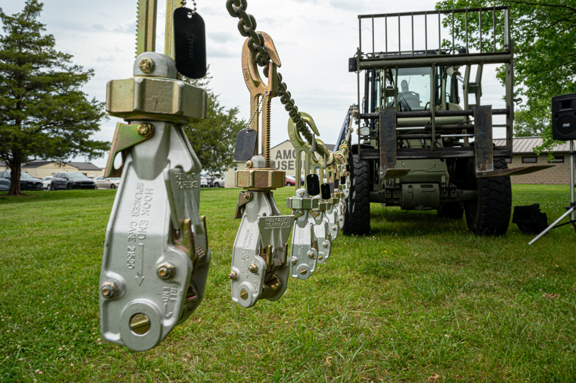 Cargo tie-down devices hang in honor of fallen aerial port members during the annual Port Dawg Memorial Run at Dover Air Force Base, Delaware, May 23, 2024. The 2.2-mile run is held each year in honor of fallen members from aerial ports across the country. (U.S. Air Force photo by Senior Airman Amanda Jett)