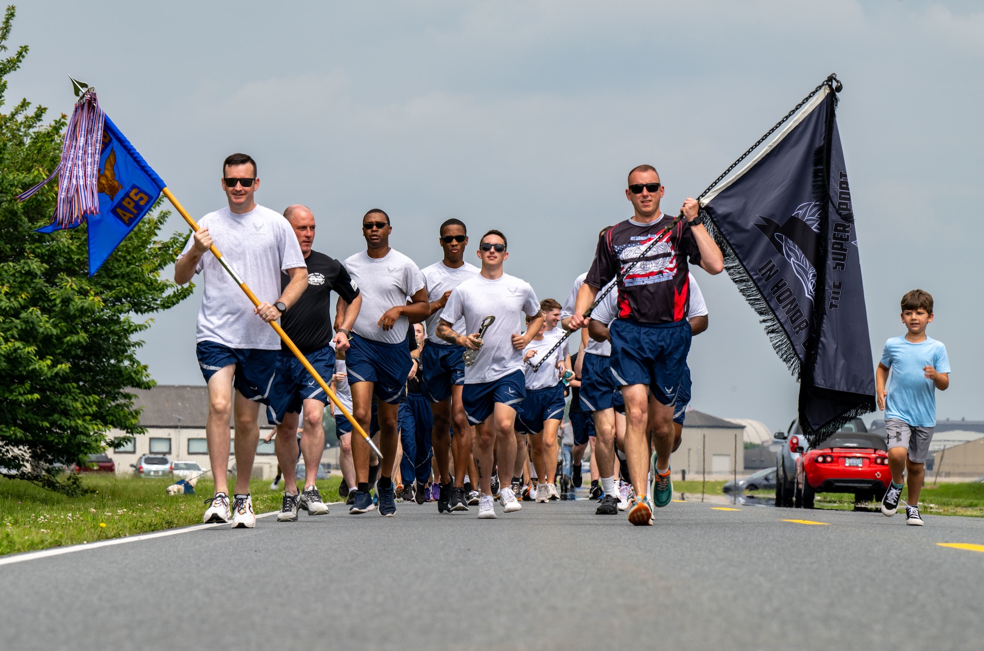 Airmen from the 436th Aerial Port Squadron participate in the Port Dawg Memorial Run at Dover Air Force Base, Delaware, May 23, 2024. The 2.2-mile run is held each year in honor of fallen members from aerial ports across the country. (U.S. Air Force photo by Senior Airman Amanda Jett)