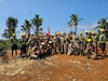 U.S. Army Soldiers assigned to the 523rd Engineer Company and Philippine engineers assigned to the 513th Engineer Construction Battalion pose for a group photo with the 130th Engineer Brigade command team while assigned to the construction of a weatherproof emergency shelter for the local municipality during Salaknib 2024 at Itbayat, Philippines, May 12, 2024.