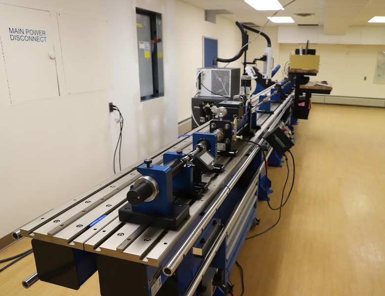 CRREL’s Split Hopkinson Pressure Bar (SHPB) can test the high strain rate material properties of various materials. This system is instrumental in capturing the material response to sudden dynamic events and allows for the tuning of strain rates for different materials in either tension or compression.