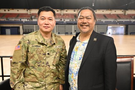 Ben de Guzman, director, D.C. Mayor’s Office on Asian and Pacific Islander Affairs (MOAPIA), and U.S. Army Spc. Oigon E. Ochirbat, attaché for the Commanding General’s Office, stand for a photograph following a panel discussion to commemorate AAPI Heritage Month at the D.C. Armory, May 28, 2024. The underlying goal of the one-hour program was to honor collective heritage and ignite a renewed commitment to foster inclusivity, understanding, and unity.