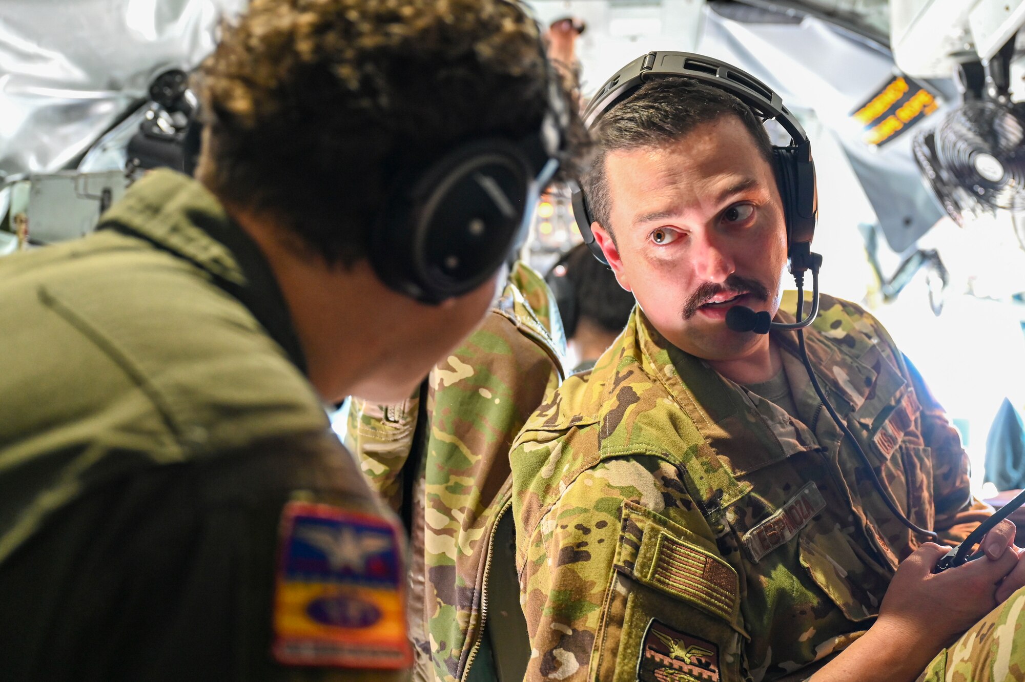 Airmen briefing another airmen