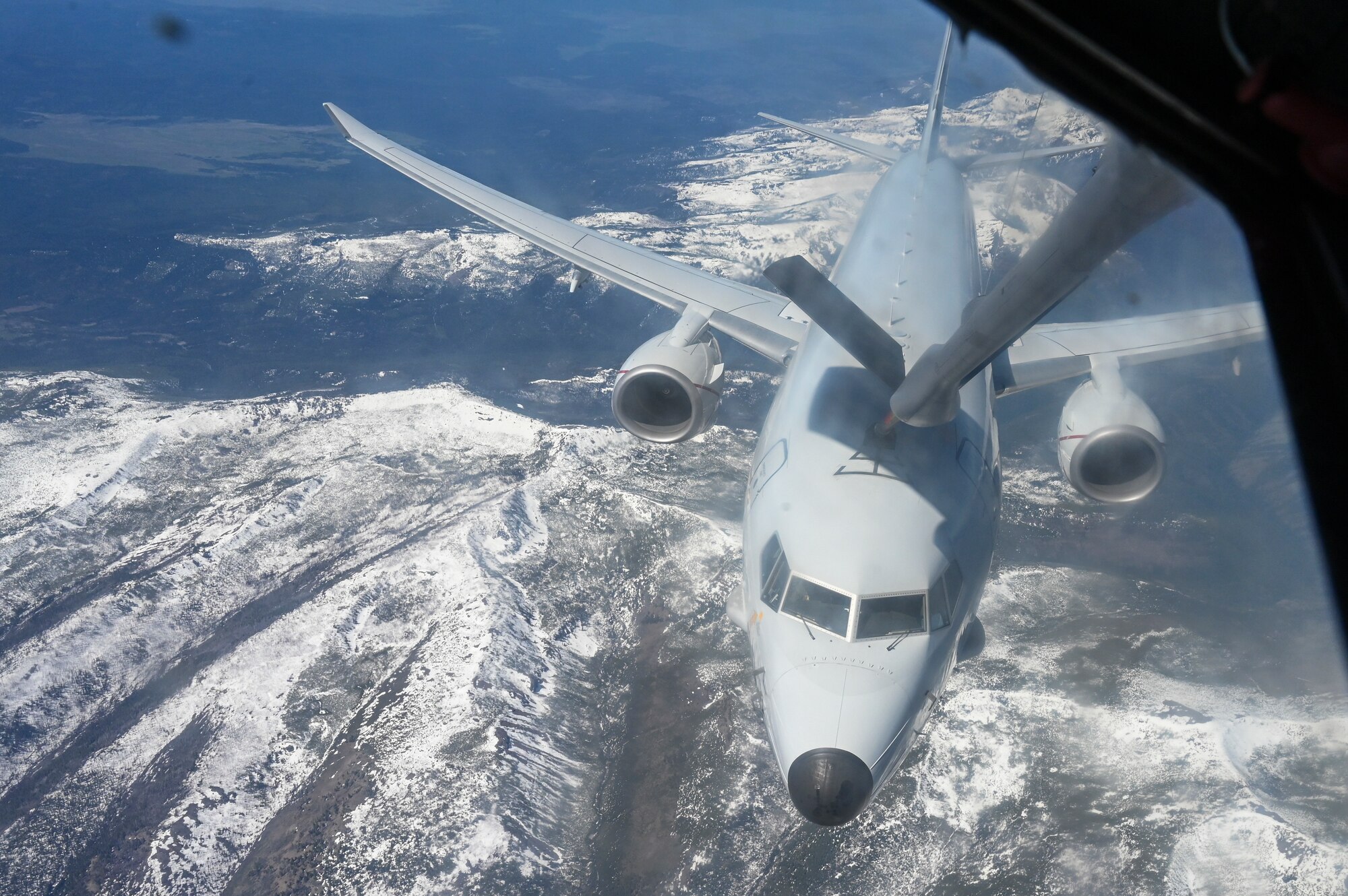 KC-135 Stratotanker refuels a P-8a Poseidon