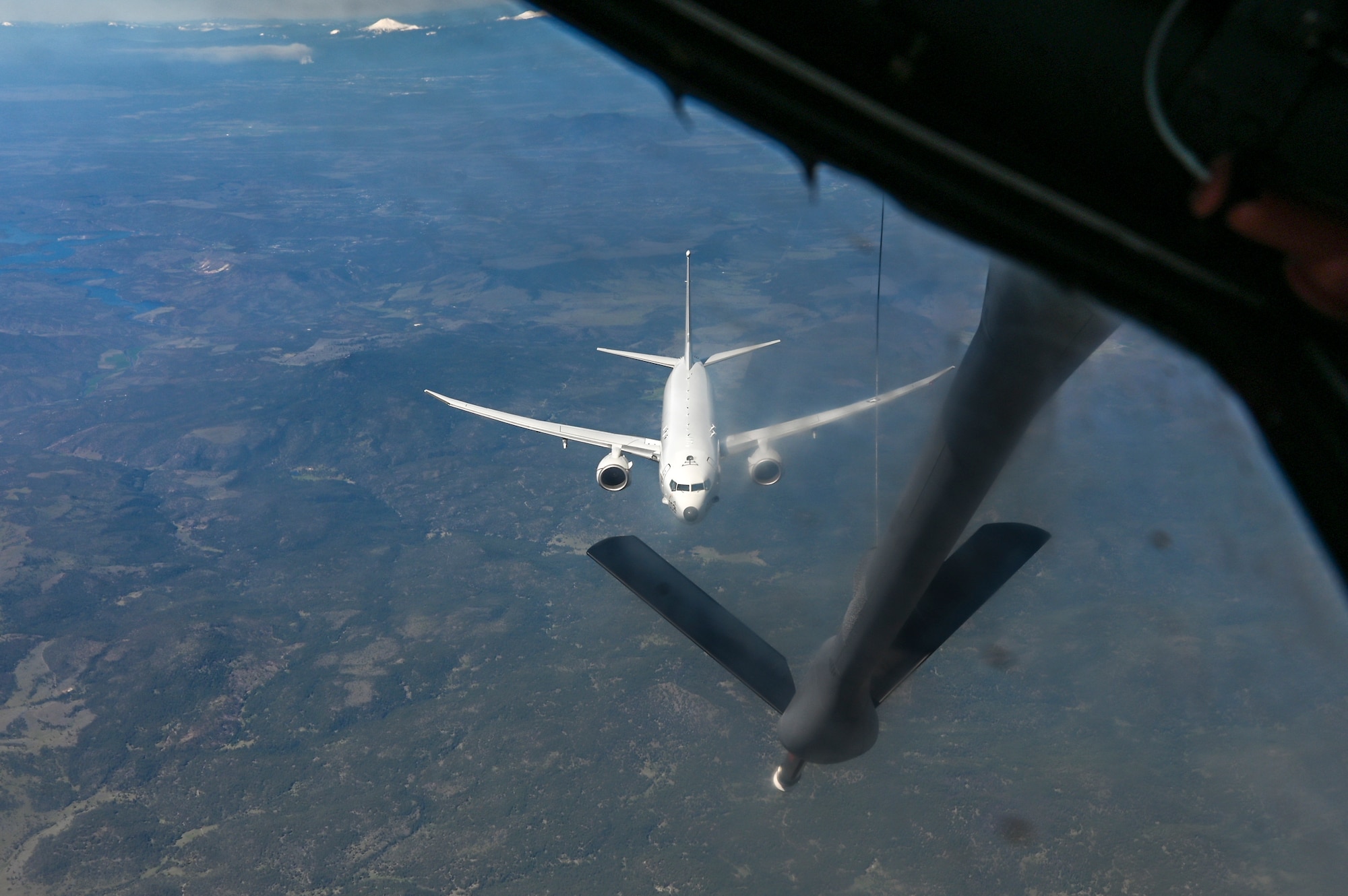 KC-135 Stratotanker refuels a P-8A Poseidon