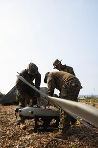 U.S. Marines with 3rd Marine Littoral Regiment, 3rd Marine Division, conduct pre-flight checks on the Stalker VXE30 unmanned aerial system during the Littoral Zone Reconnaissance Cobra exercise for Archipelagic Coastal Defense Continuum at Camp Cape Bojeador, Philippines, May 20, 2024. LZR Cobra is a bilateral command post exercise between the U.S. Marines with 3rd MLR and the Philippine Marines with the Coastal Defense Regiment and 4th Marine Brigade aimed at enhancing interoperability, refining tactics, techniques, and procedures, and supporting the combined and joint force maritime domain awareness. ACDC is a series of bilateral exchanges and training opportunities between U.S. Marines and Philippine Marines aimed at bolstering the Philippine Marine Corps’ Coastal Defense strategy while supporting the modernization efforts of the Armed Forces of the Philippines. (U.S. Marine Corps photo by Cpl. Eric Huynh)