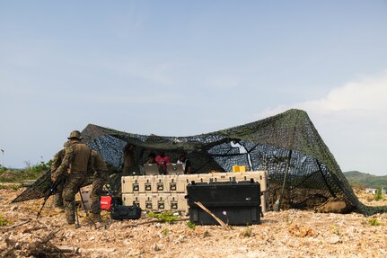 U.S. Marines with 3rd Marine Littoral Regiment, 3rd Marine Division, set up a satellite during the Littoral Zone Reconnaissance Cobra exercise for Archipelagic Coastal Defense Continuum at Camp Cape Bojeador, Philippines, May 20, 2024. LZR Cobra is a bilateral command post exercise between the U.S. Marines with 3rd MLR and the Philippine Marines with the Coastal Defense Regiment and 4th Marine Brigade aimed at enhancing interoperability, refining tactics, techniques, and procedures, and supporting the combined and joint force maritime domain awareness.  ACDC is a series of bilateral exchanges and training opportunities between U.S. Marines and Philippine Marines aimed at bolstering the Philippine Marine Corps’ Coastal Defense strategy while supporting the modernization efforts of the Armed Forces of the Philippines. (U.S. Marine Corps photo by Cpl. Eric Huynh)