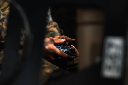 A U.S. Marine with 3rd Marine Littoral Regiment, 3rd Marine Division, remotely controls a small unmanned aircraft system during the Littoral Zone Reconnaissance Cobra exercise for Archipelagic Coastal Defense Continuum at Camp Cape Bojeador, Philippines, May 20, 2024. LZR Cobra is a bilateral command post exercise between the U.S. Marines with 3rd MLR and the Philippine Marines with the Coastal Defense Regiment and 4th Marine Brigade aimed at enhancing interoperability, refining tactics, techniques, and procedures, and supporting the combined and joint force maritime domain awareness.  ACDC is a series of bilateral exchanges and training opportunities between U.S. Marines and Philippine Marines aimed at bolstering the Philippine Marine Corps’ Coastal Defense strategy while supporting the modernization efforts of the Armed Forces of the Philippines. (U.S. Marine Corps photo by Cpl. Eric Huynh)