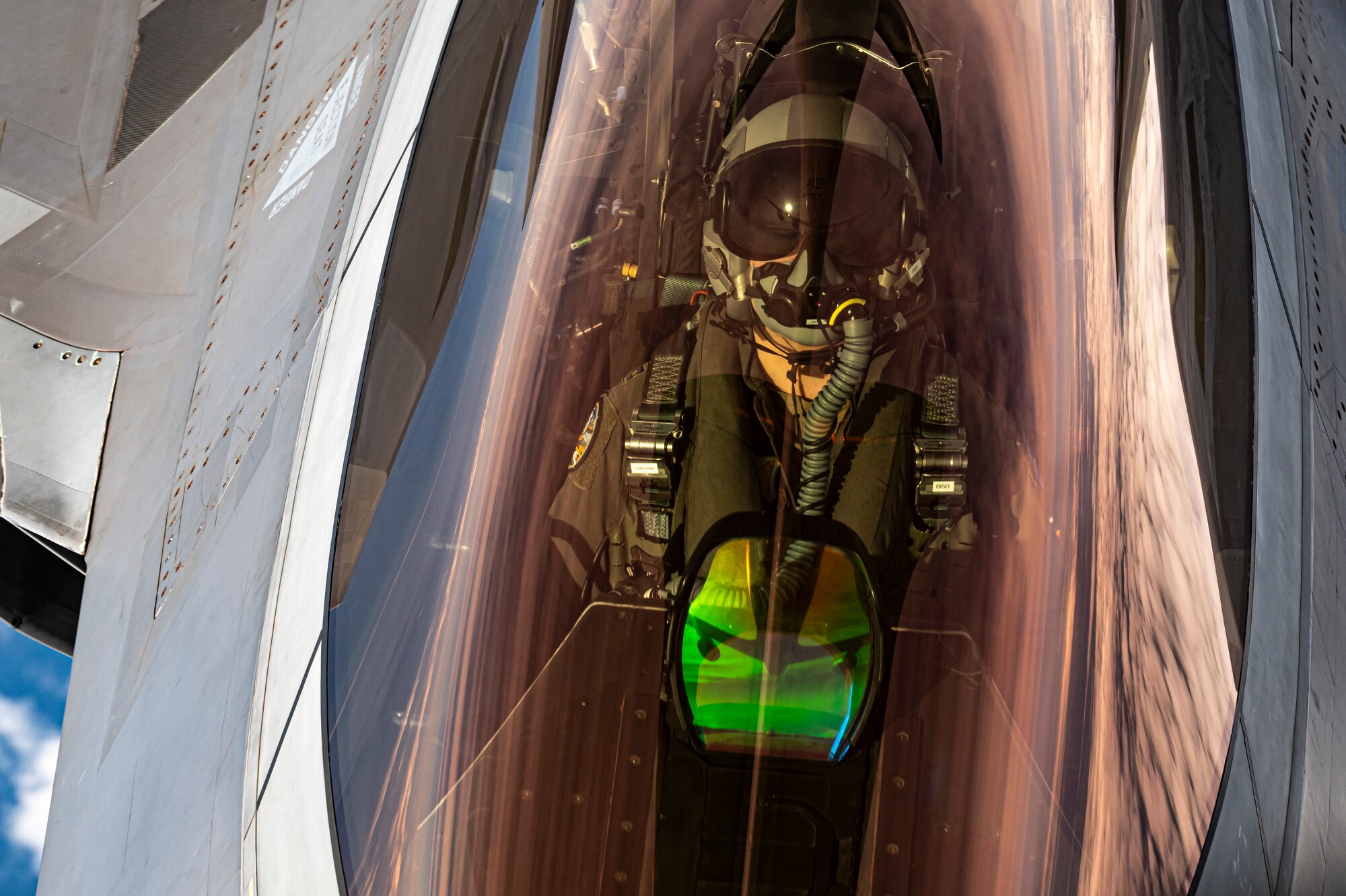 A U.S. Air Force F-22 Raptor receives fuel from an Air Force KC-135 Stratotanker during exercise Checkered Flag.