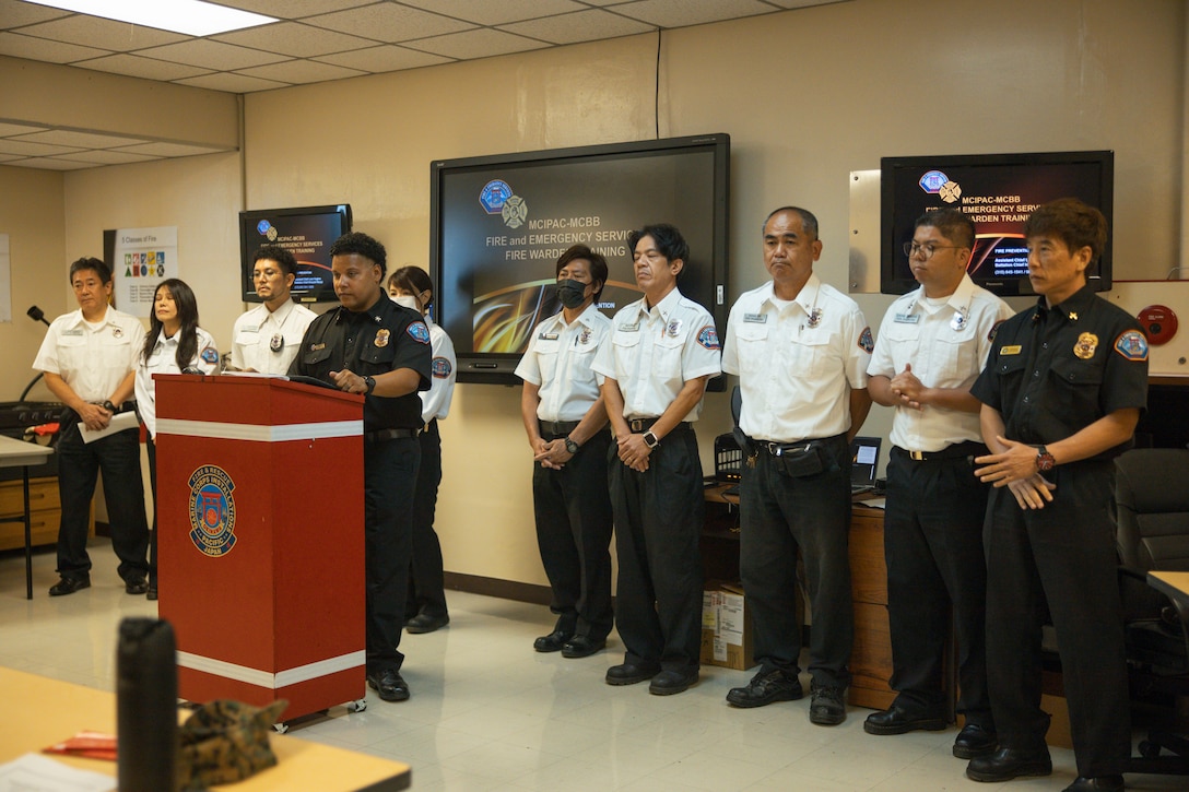 Fire inspectors with the fire prevention branch, Marine Corps Installations Pacific Fire and Emergency Services, introduce themselves during fire warden training on Camp Foster, Okinawa, Japan, May 9, 2024. Hosted regularly by MCIPAC F&ES, the fire warden program is designed to provide commands with in-house representatives capable of identifying safety deficiencies on a daily basis. Through their innovation and excellence in fire prevention inspections, community outreach, public education programs and more, MCIPAC F&ES was nominated and selected as the 2023 Department of Defense Fire Prevention Program of the Year. (U.S. Marine Corps photo by Sgt. Alex Fairchild)