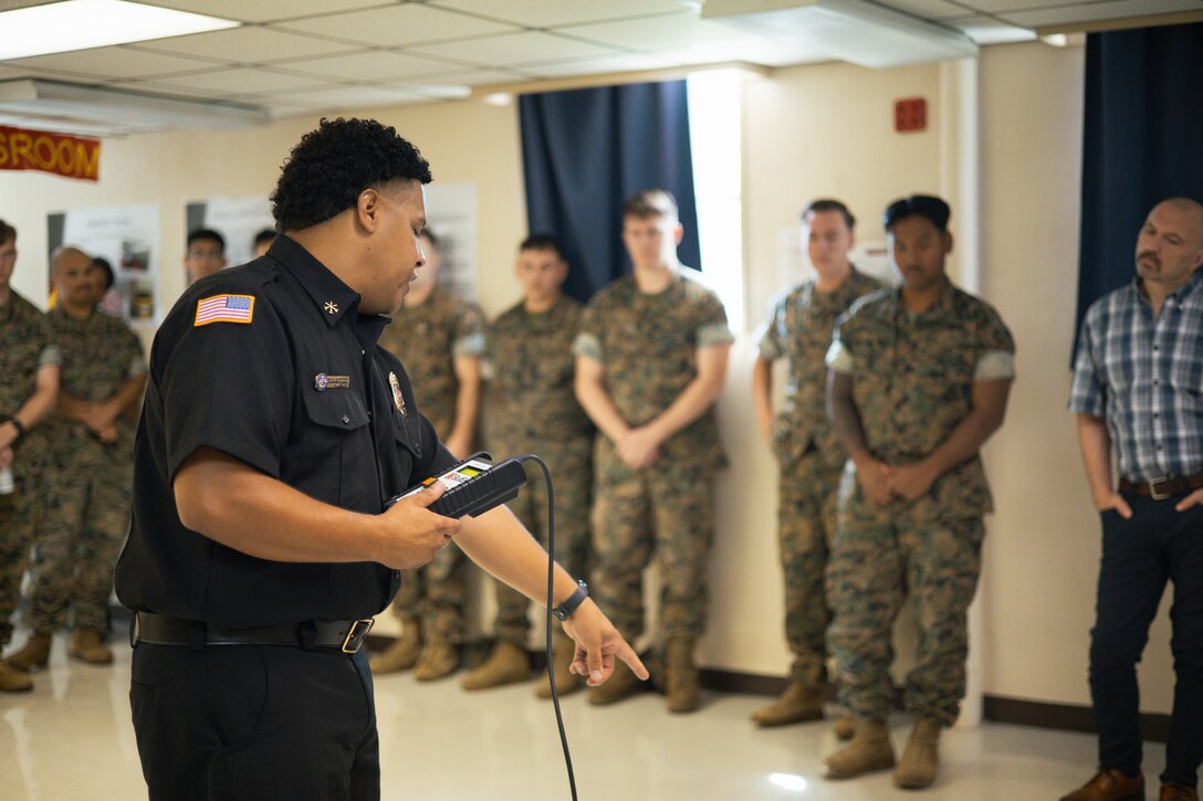 Leon Hughes, an assistant fire chief with Marine Corps Installations Pacific Fire and Emergency Services, instructs during fire warden training on Camp Foster, Okinawa, Japan, May 9, 2024. Hosted regularly by MCIPAC F&ES, the fire warden program is designed to provide commands with in-house representatives capable of identifying safety deficiencies on a daily basis. Through their innovation and excellence in fire prevention inspections, community outreach, public education programs and more, MCIPAC F&ES was nominated and selected as the 2023 Department of Defense Fire Prevention Program of the Year. (U.S. Marine Corps photo by Sgt. Alex Fairchild)