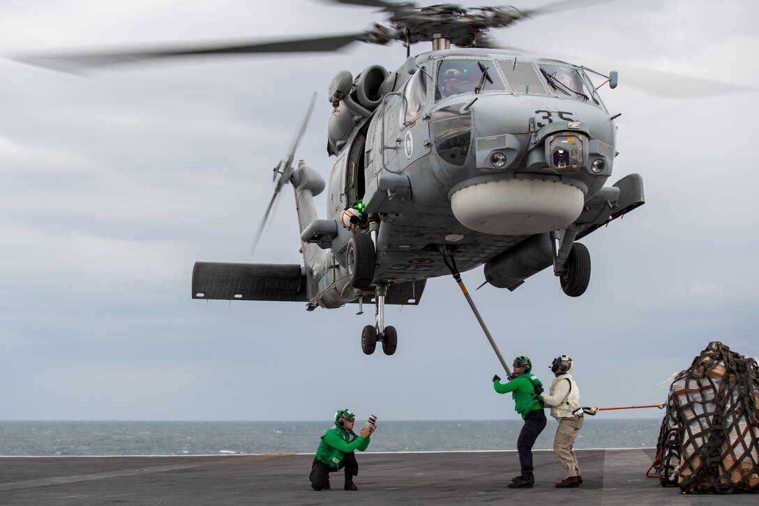 USS George Washington (CVN 73) during a vertical replenishment  with the Brazilian navy.