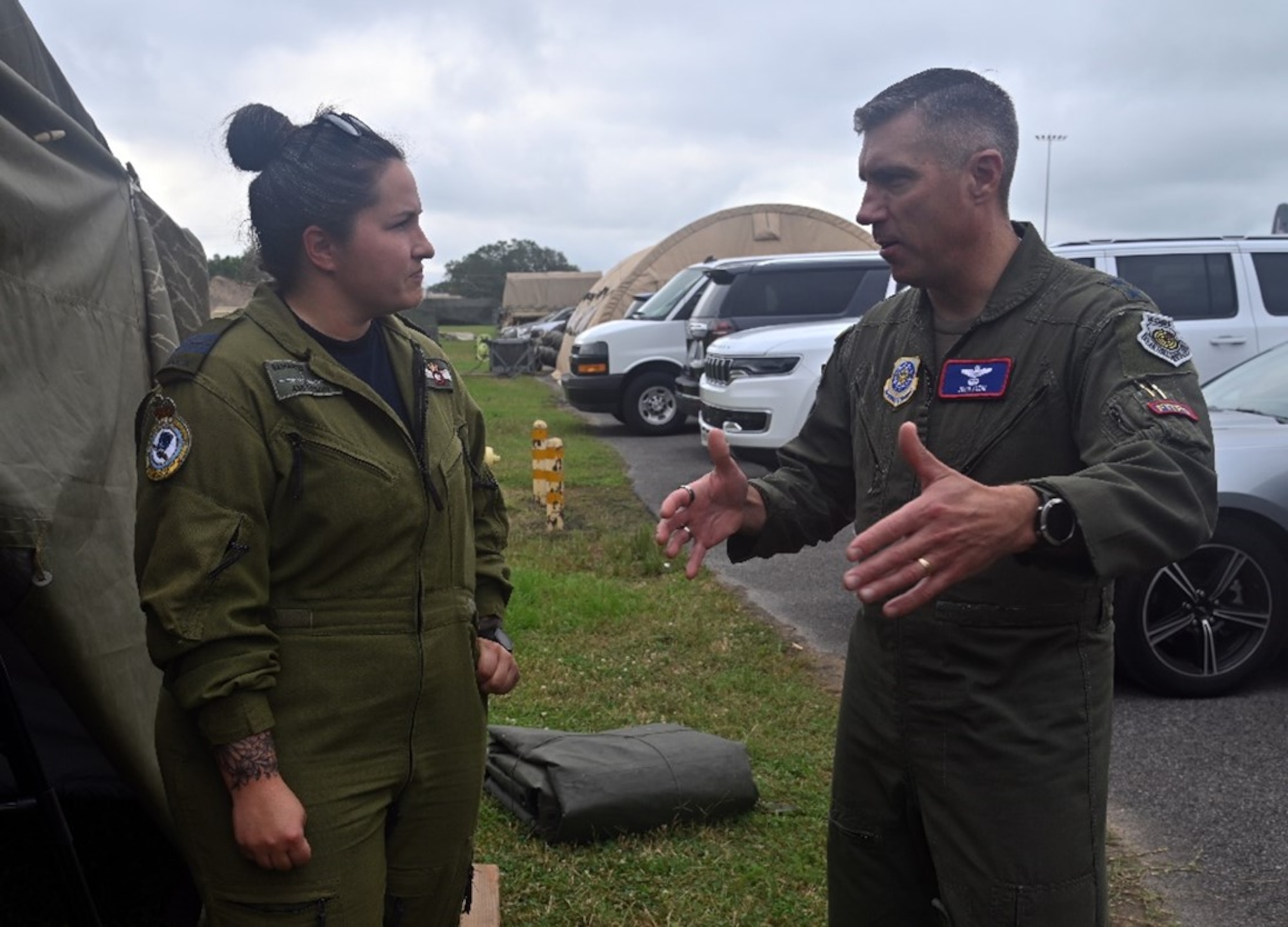 U.S. Air Force Maj. Gen. John Klein, U.S. Air Force Expeditionary Center commander, has a conversation with Royal Canadian air force Maj. Samantha Behm, 436th Transport Squadron operations commander, during Exercise Storm Flag in Alexandria, La., May 6, 2024. The exercise aimed to support the U.S. Army’s 10th Mountain Division deployment certification and scheme of maneuver.