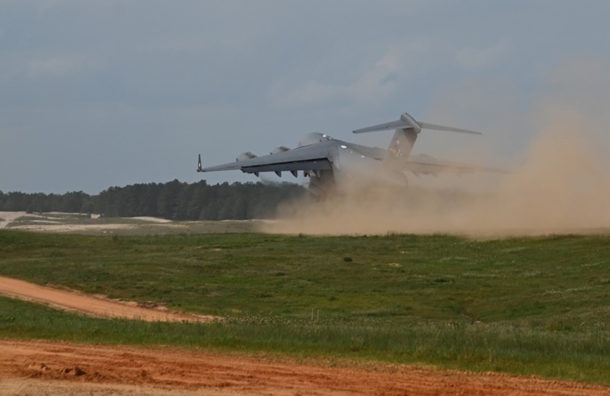 A C-17 Globemaster III takes off at Geronimo Landing Zone during Exercise Storm Flag in Alexandria, La., May 6, 2024. The exercise aimed to support the U.S. Army’s 10th Mountain Division deployment certification and scheme of maneuver.