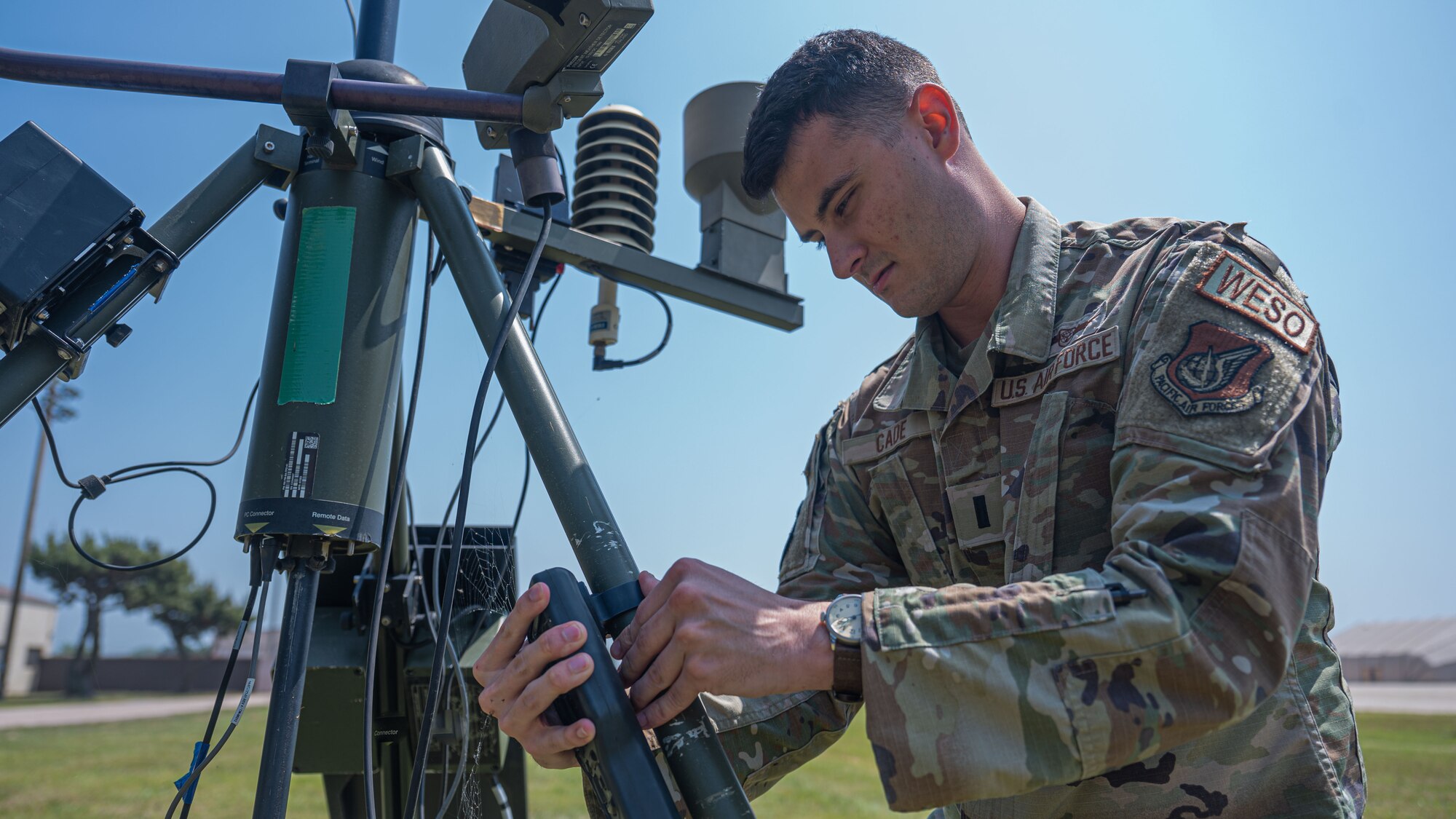 1st Lt. Evan Cade, 8th Operations Support Squadron weather flight commander, checks weather monitoring equipment.
