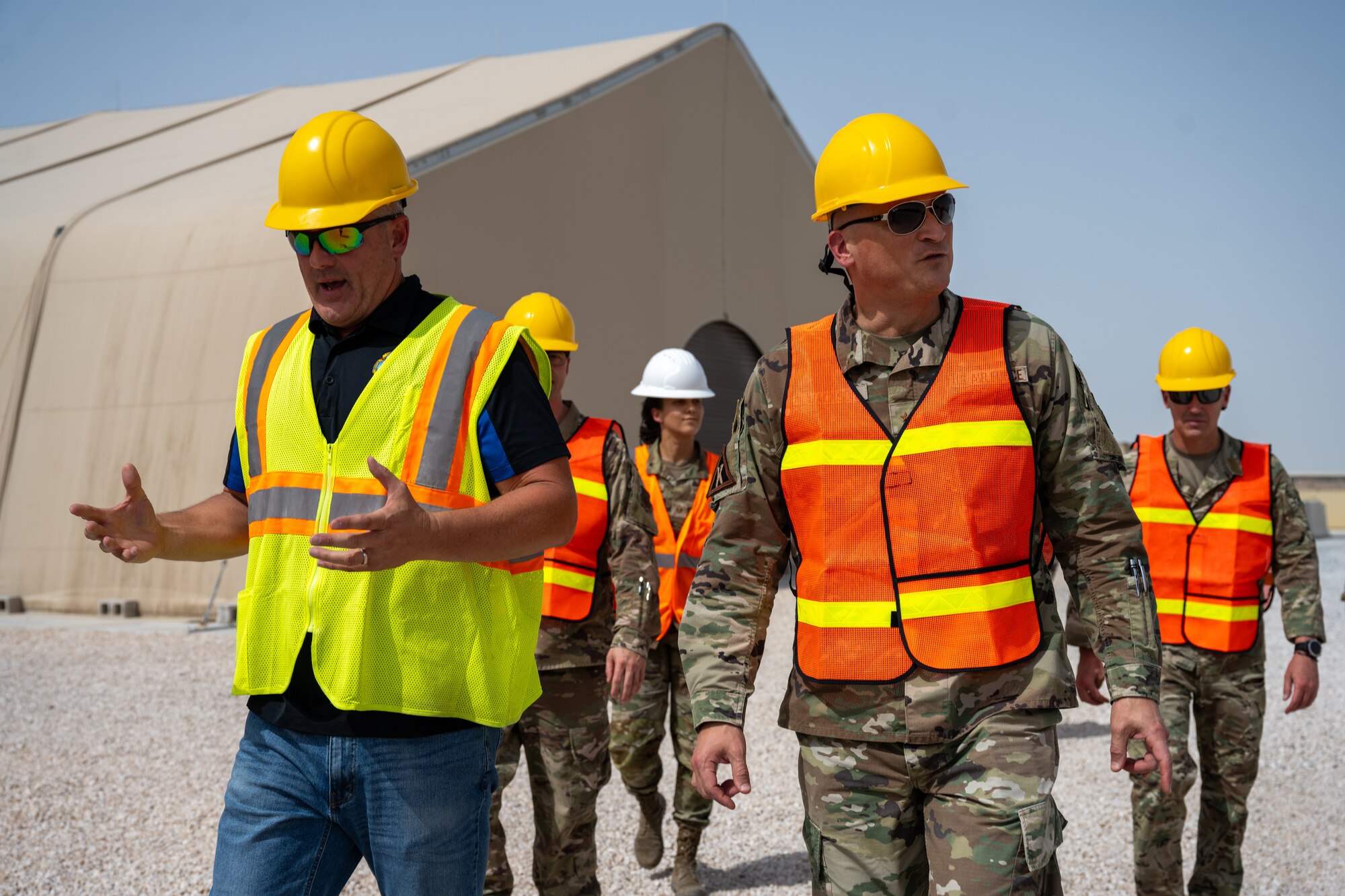 Roosevelt Terrell, Defense Logistics Agency Disposition Services Central Region deputy director, left, provides insight to U.S. Air Force Brig. Gen. Douglas Jackson, 379th Air Expeditionary Wing commander, during a tour of a DLA facility at an undisclosed location in the U.S. Central Command area of responsibility, May 16, 2024.