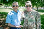 U.S. Army Command Sgt. Maj. Arthur Fredericks, the Connecticut National Guard's senior enlisted advisor, presents Rick Maynard a Connecticut World War I Campaign Medal in honor of his great-uncle's service with the 102nd Infantry Regiment in World War I. Sgt. Paul Maynard served with Company M in multiple battles across France and ultimately perished on the last day of the War.