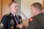 Staff Sgt. Brock WIlson, an Oklahoma City resident and Oklahoma Army National Guard member is recognized as the US National Guard Region V Noncommissioned Officer of the Year. (U.S. Army National Guard photo by Sgt. Gauret Stearns)