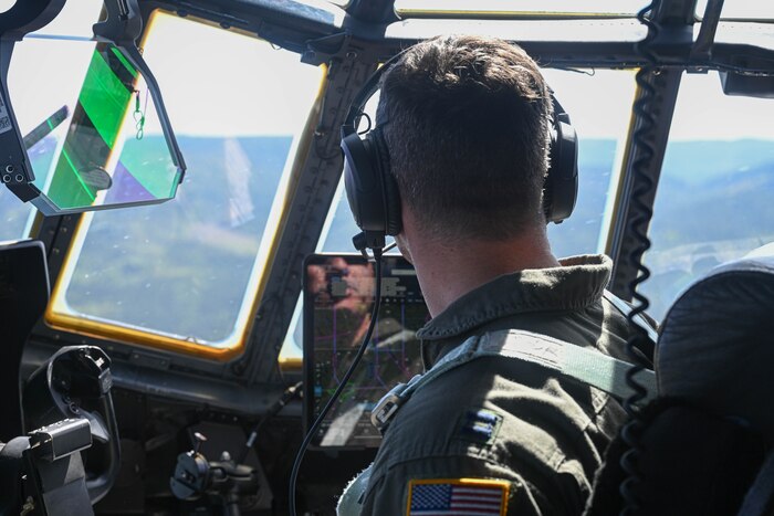 U.S. Air Force Capt. Cory Thomas, 61st Airlift Squadron pilot, flies over mountains in Norway, May 13, 2024. Collaboration is at the core of the C-130J's mission. Designed with interoperability in mind, it seamlessly integrates with Allied forces, facilitating joint operations and enhancing military cooperation.
