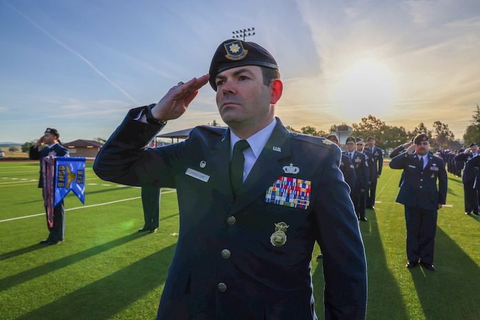 U.S. Air Force Maj. Patrick Livingstone, 9th Security Forces commander, salutes for reveille during the 9th Mission Support Group open ranks inspection at Beale Air Force Base, California, April 10, 2024.