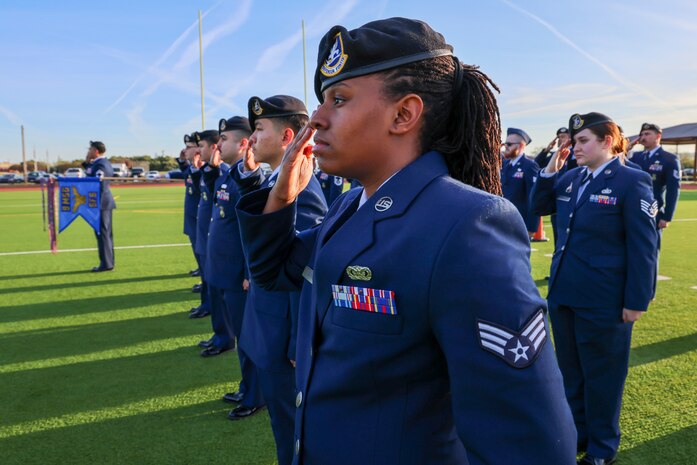 U.S. Air Force Senior Airman Aaisha Banks, 9th Security Forces Security cybersecurity liaison, salutes for reveille during the 9th Mission Support Group open ranks inspection at Beale Air Force Base, California, April 10, 2024.