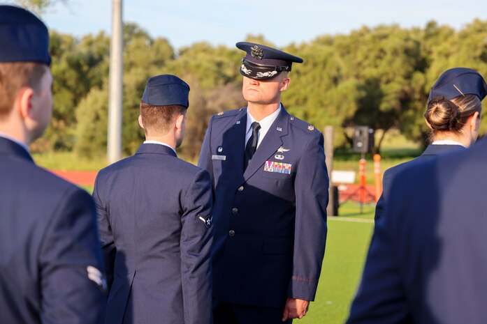 U.S. Air Force Maj. Joshua Larson, 9th Communications Squadron commander, inspects members of the 9th CS during the 9th Mission Support Group open ranks inspection at Beale Air Force Base, California, April 10, 2024.
