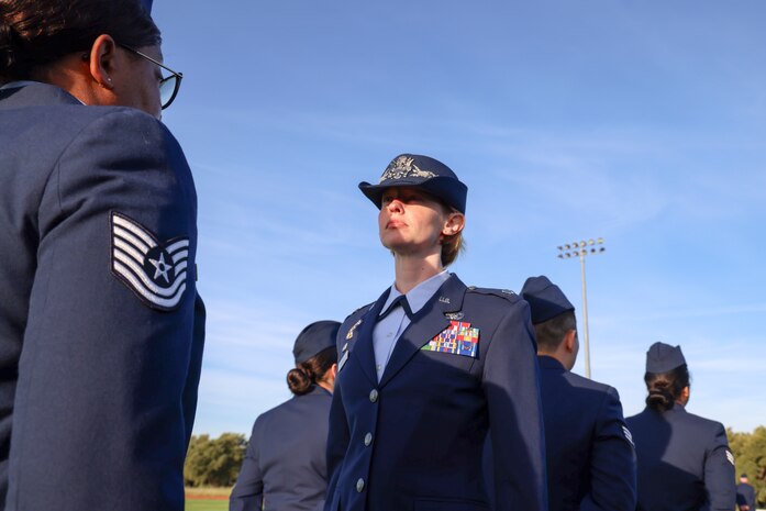 U.S. Air Force Lt. Col. Lindsey Nichols, 9th Logistics Readiness Squadron commander, inspects members of the 9th LRS during the 9th Mission Support Group open ranks inspection at Beale Air Force Base, California, April 10, 2024.