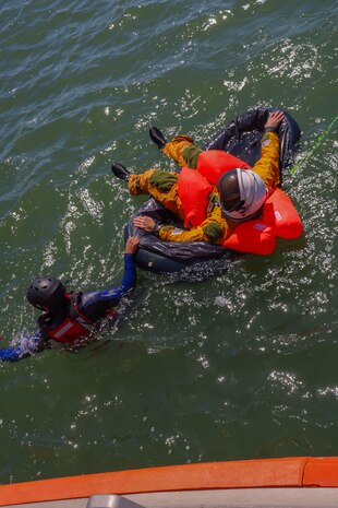 U.S. Air Force Senior Airman Nathaniel Carbajal, 9th Operational Support Squadron survival, evasion, resistance and escape specialist, swims a 9th Reconnaissance U-2 Dragon Lady pilot back to the boat at the end of training in San Francisco Bay, California, April 30, 2024.