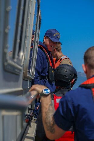 U.S. Coast Guard Fireman Ethan Carter, USCG San Francisco Sector, welcomes everyone back aboard at the end of training in the San Francisco Bay, California, April 30, 2024.